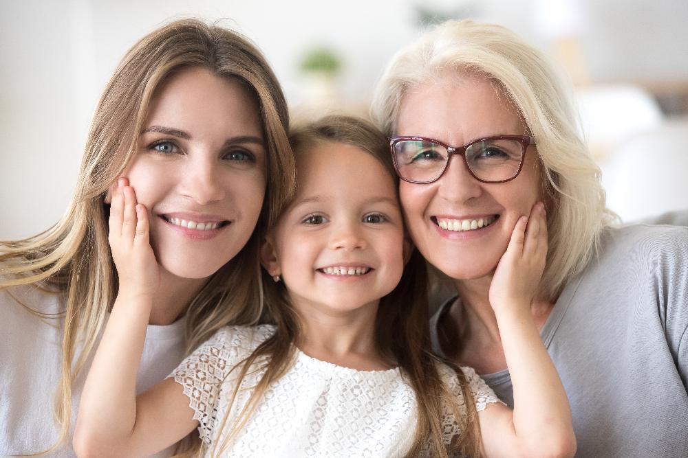 mother, daughter, and grandma smiling