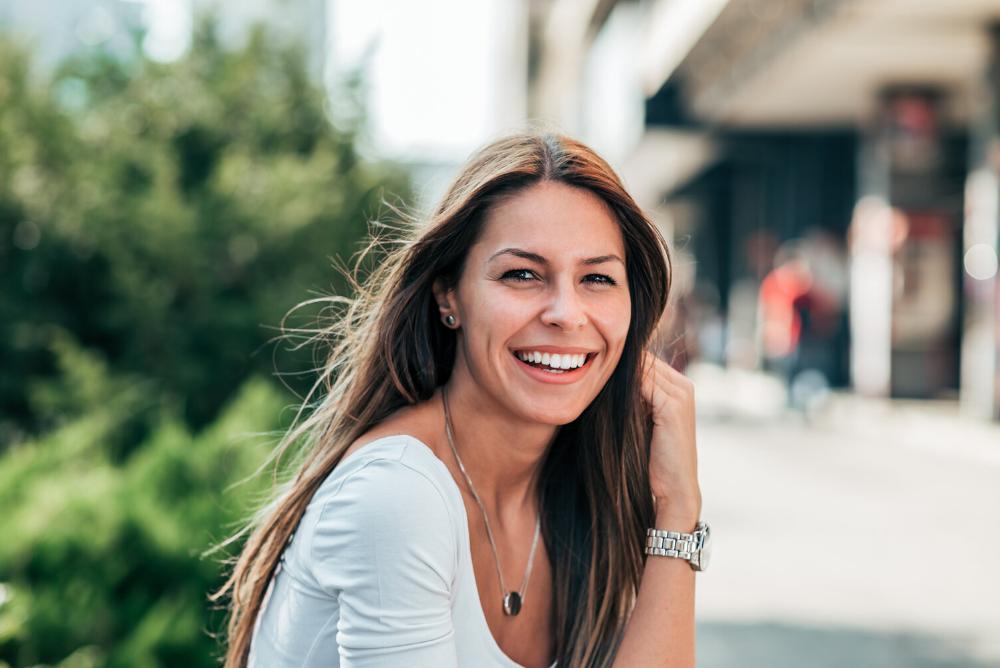 woman smiling after getting veneers in brisbane