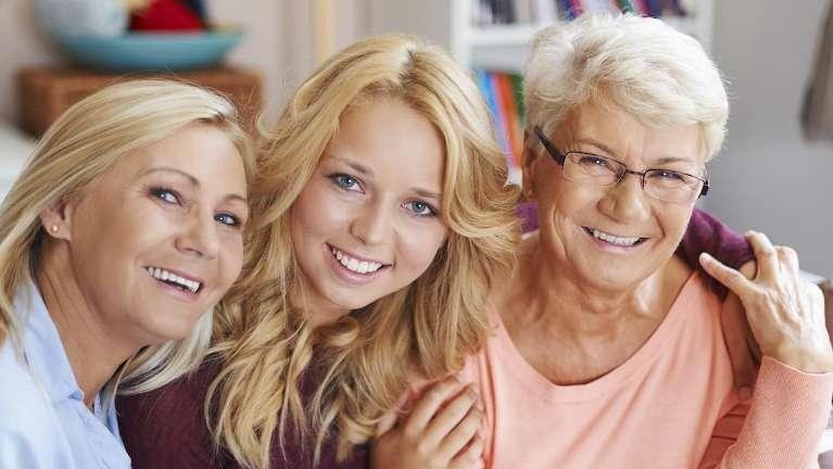 mother, daughter, and grandmother smiling