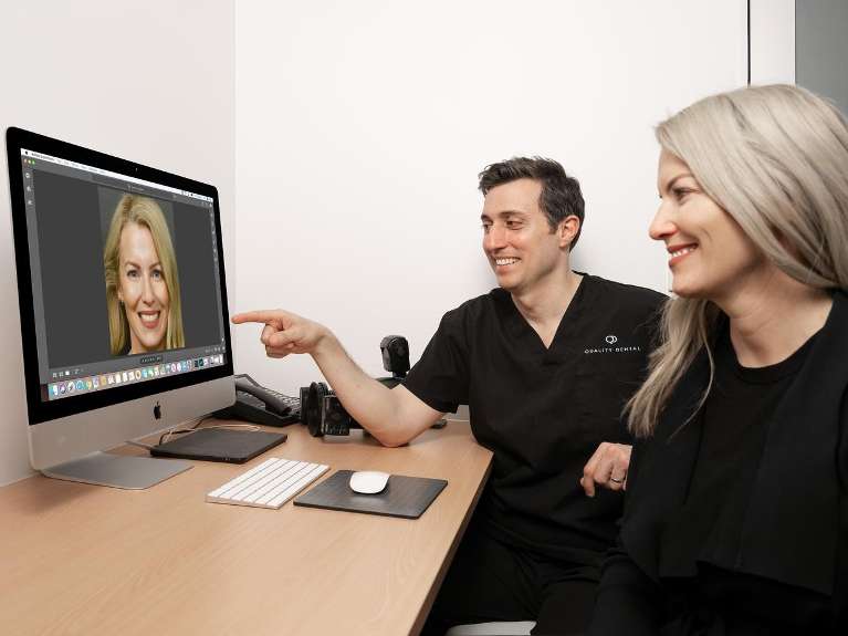 Dentist in Brisbane CBD consulting with patient about digital smile design