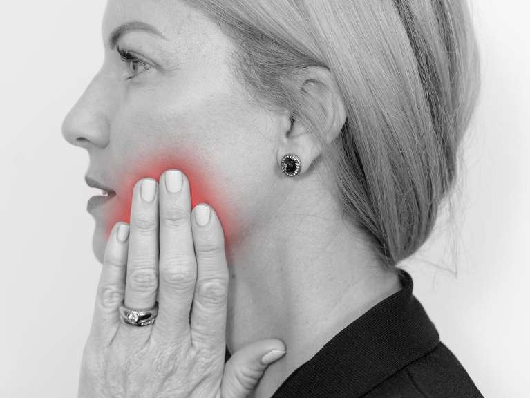 Patient with bad tooth pain from dental emergency near Brisbane