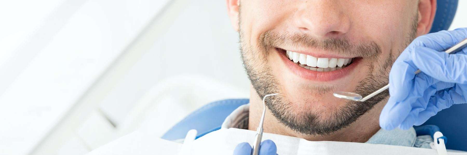 man getting a dental clean in brisbane