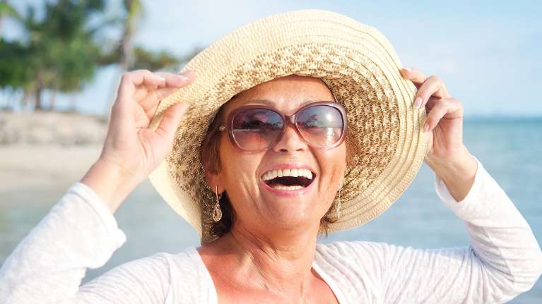 woman smiling at the beach