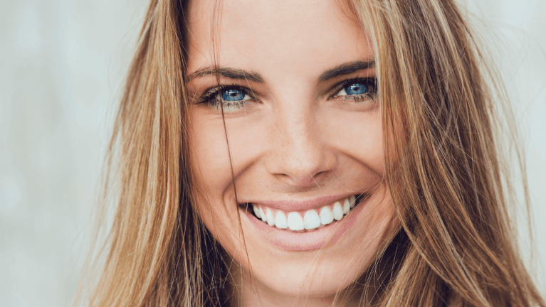 woman smiling after cleaning in brisbane 
