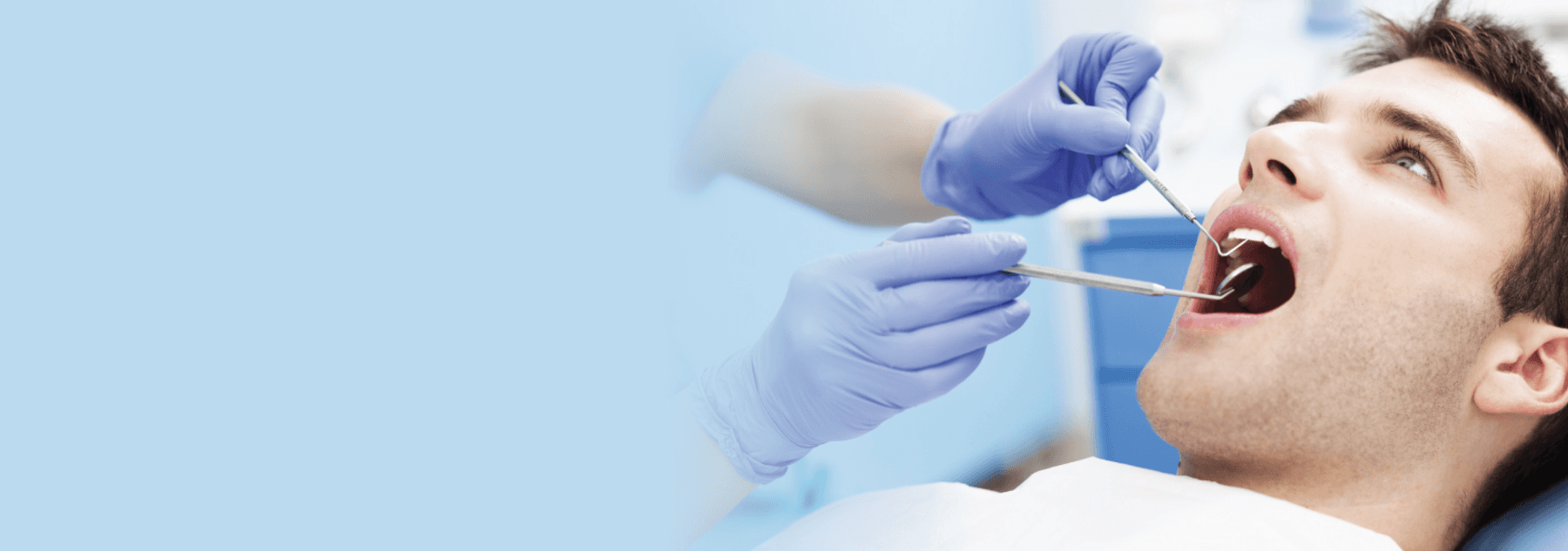 man getting dental treatment in Brisbane