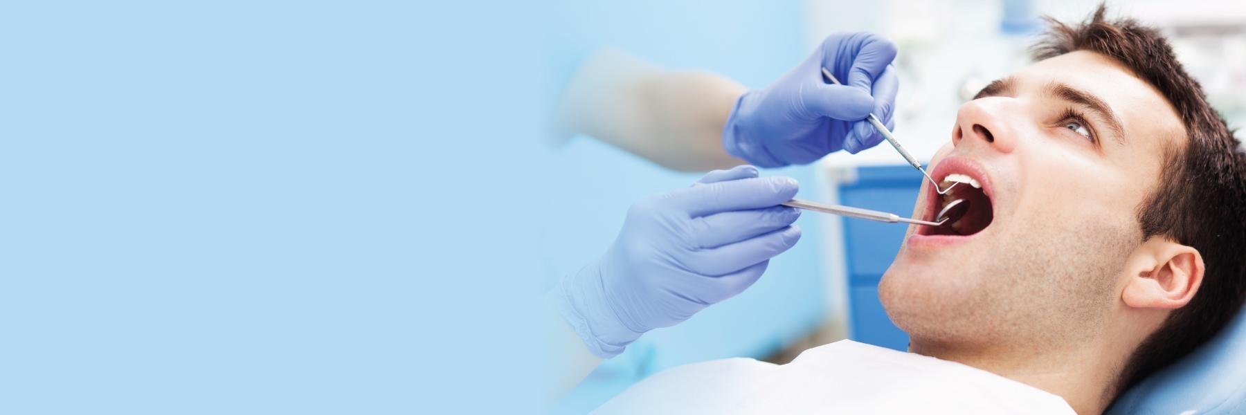 Patient getting periodontal exam at dentist in Brisbane